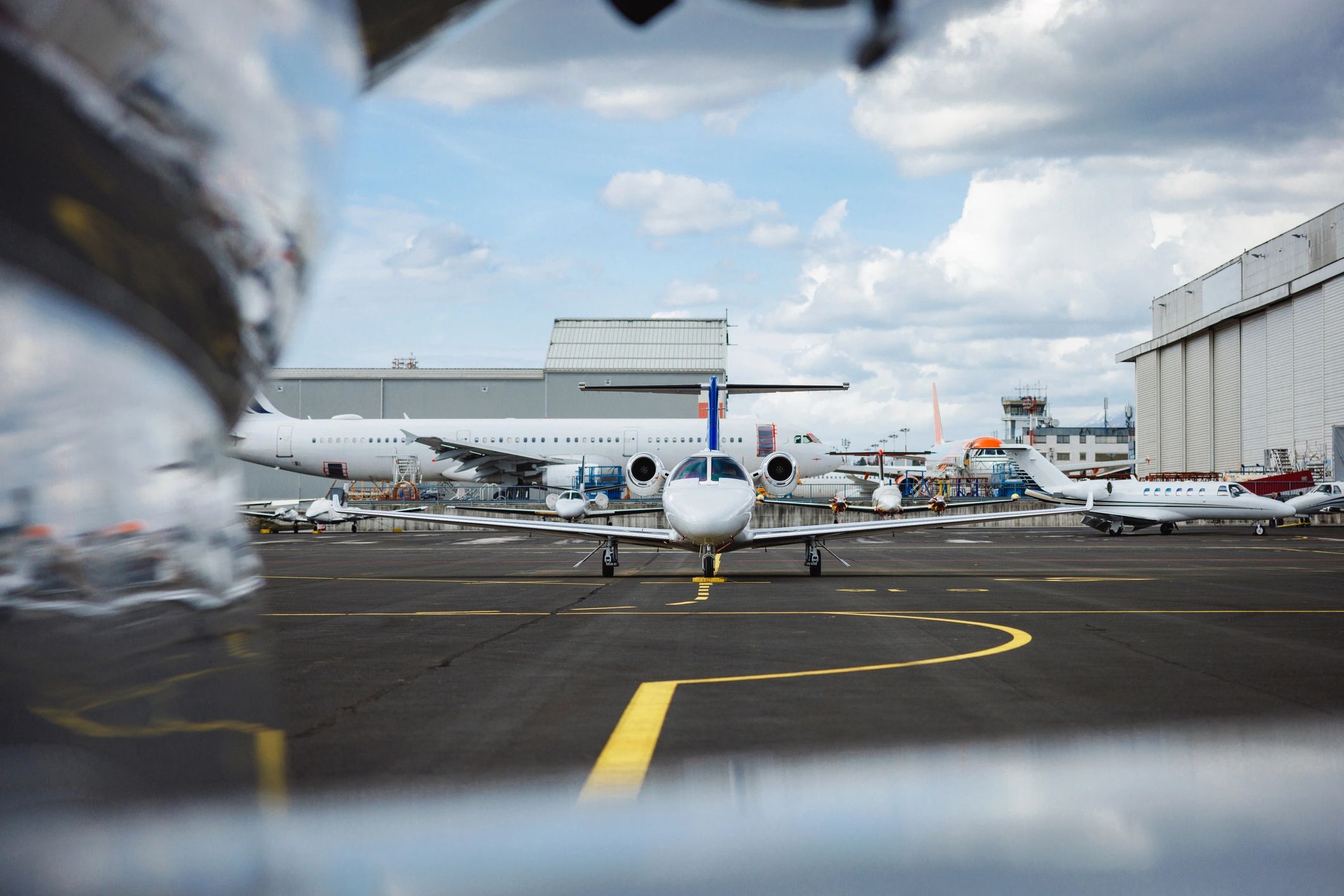 Corporate aircraft parked on an airport tarmac